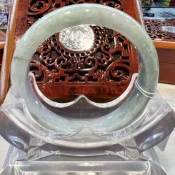 A close up of an open bangle on display