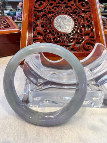 A close up of an asian bangle on top of a table