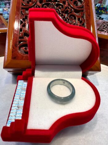 A ring in a box on top of a table.