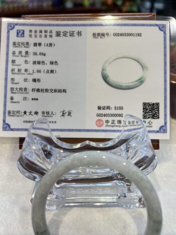 A clear plastic ring sitting on top of a table.