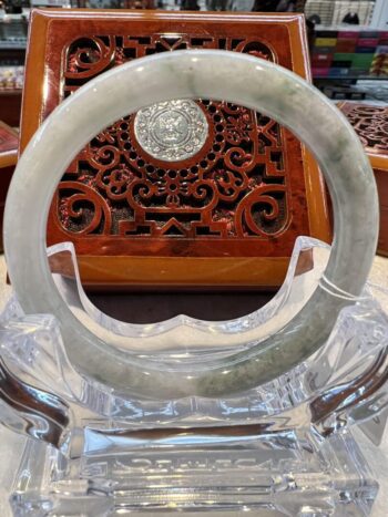 A close up of an asian style carved wooden chair