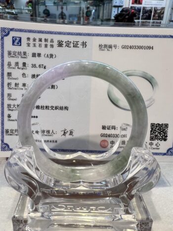 A glass ring sitting on top of a certificate.