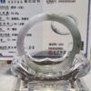 A glass ring sitting on top of a table.