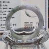 A large glass ring sitting on top of a table.