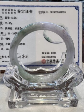 A large glass ring sitting on top of a table.