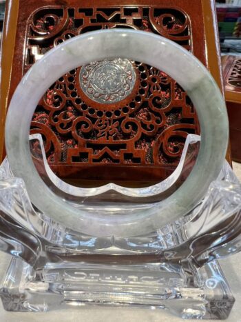 A close up of the inside of an asian style mirror.