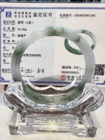 A glass bowl with a green and white design.