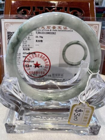 A glass ring with a certificate of authenticity.