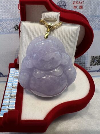 A purple buddha sitting in a box on top of a red carpet.