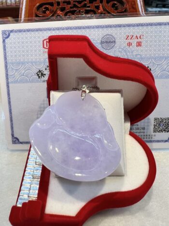 A large piece of lavender jade in a red box.