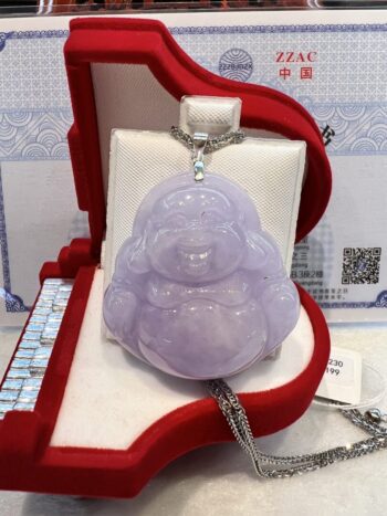 A purple jade buddha is sitting in a red case.