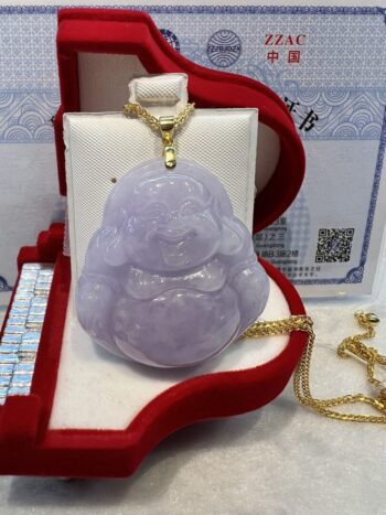 A purple jade buddha sitting in a red box.