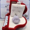 A red box with a purple buddha sitting in it