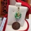 A coin and some jewelry in a box