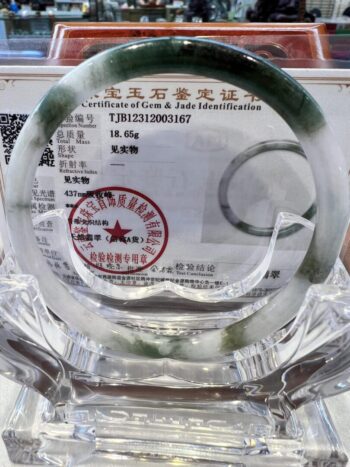 A glass plate with a certificate of authenticity.