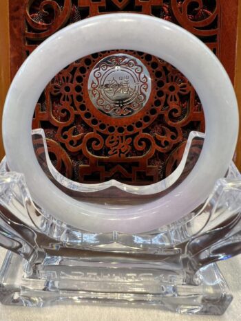 A white plate sitting on top of a wooden table.