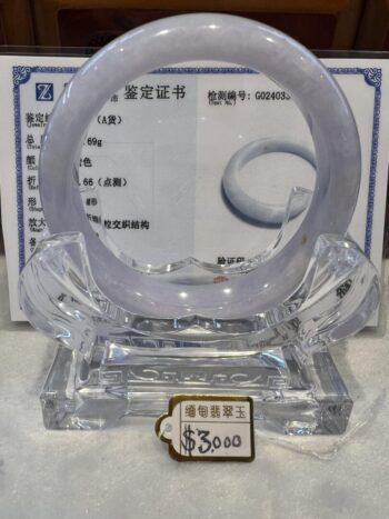 A clear glass ring sitting on top of a table.