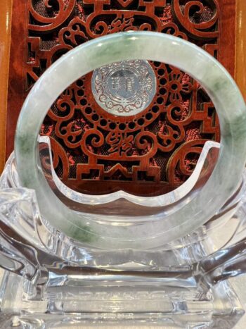 A close up of the inside of an asian style carved wooden table.