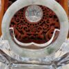 A close up of the clock on top of a table