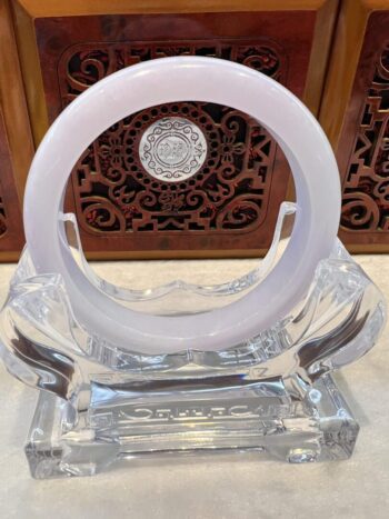 A white ring sitting on top of an ice sculpture.