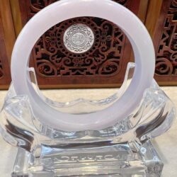 A white ring sitting on top of an ice sculpture.