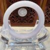 A white ring sitting on top of a glass table.