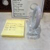 A note and a glass holder on the counter.