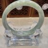 A close up of an asian jade bangle