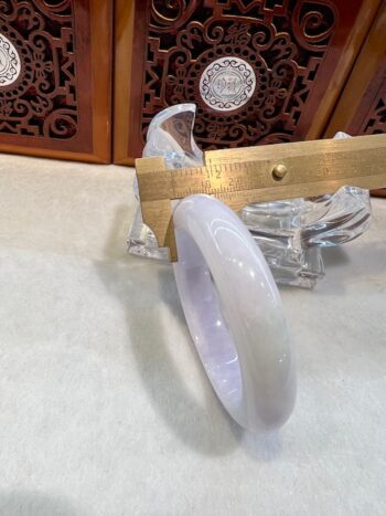 A white marble bowl sitting on top of a table.