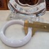 A white bangle sitting on top of a table.