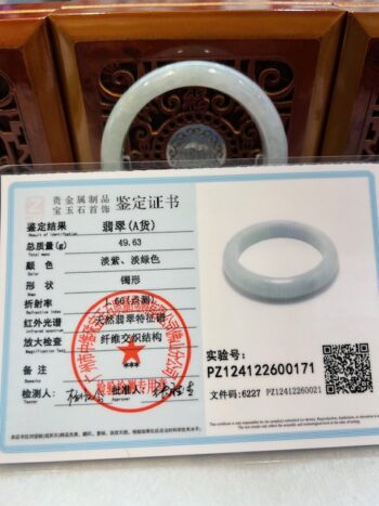 A picture of an id card and a ring.