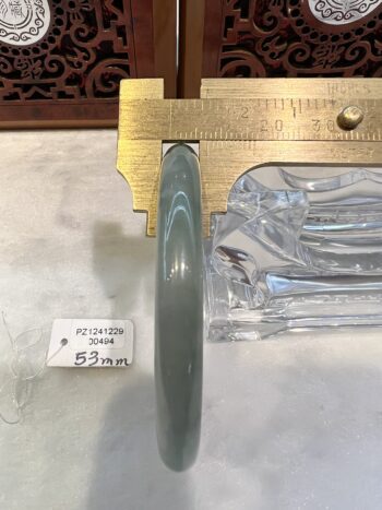 A close up of a plate with a ruler and some plastic