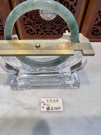 A glass and metal object sitting on top of a table.