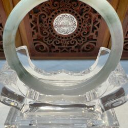 Pale lavender jade bracelet on crystal holder