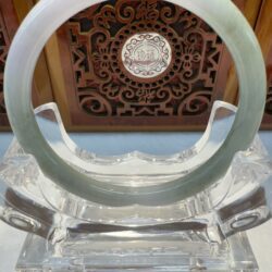 Translucent white jade bangle display