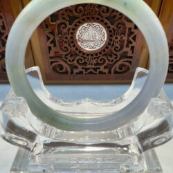 Circular jade bangle front view with carving