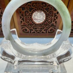 Front view pale jade bangle with wood carving
