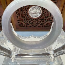 Pale lavender jade bangle on acrylic stand
