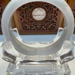 Jade hoop ornament framed by ornate panel