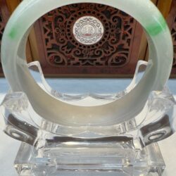 White jade bangle with emerald flecks