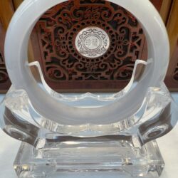 Translucent white jade bangle with carved background