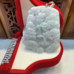 Jade pendant in red velvet display box.