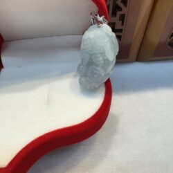 Jade pendant in red velvet box.
