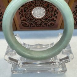 Smooth mint jade circle on clear stand
