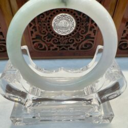 Pale white jade bangle with dark inclusion