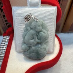Jade pendant in red velvet box.