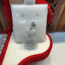 Jade pendant in red jewelry box.