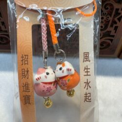 Lucky cat charms in packaged hanging set.