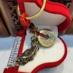 Lucky charm in red velvet jewelry box.