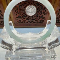 Milky pale jade bangle on stand